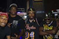 a group of men posing for a picture