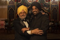 two men in turbans posing for a photo