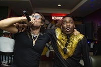 a man is holding a microphone