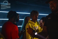 a group of people standing in a dark room