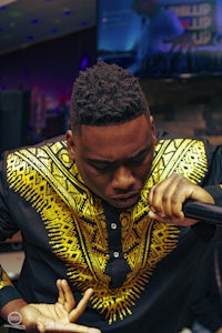 a man is holding a microphone