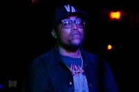 a man wearing glasses and a hat